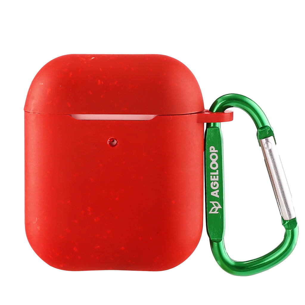 a red piece of luggage sitting on a table 